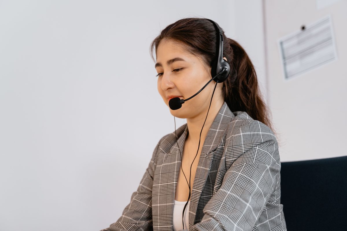 A friendly ABAC team member on the phone, ready to talk about your loved one's care
